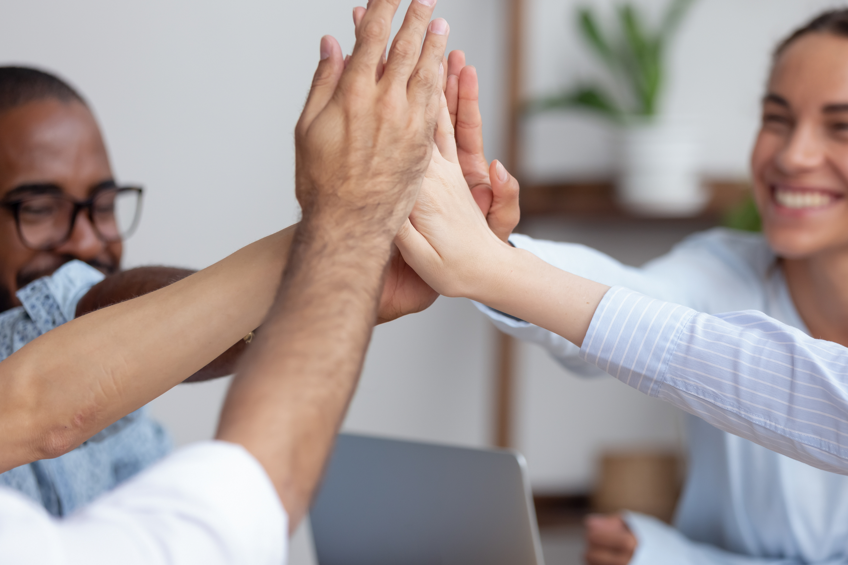 A group of people giving each other high-fives.